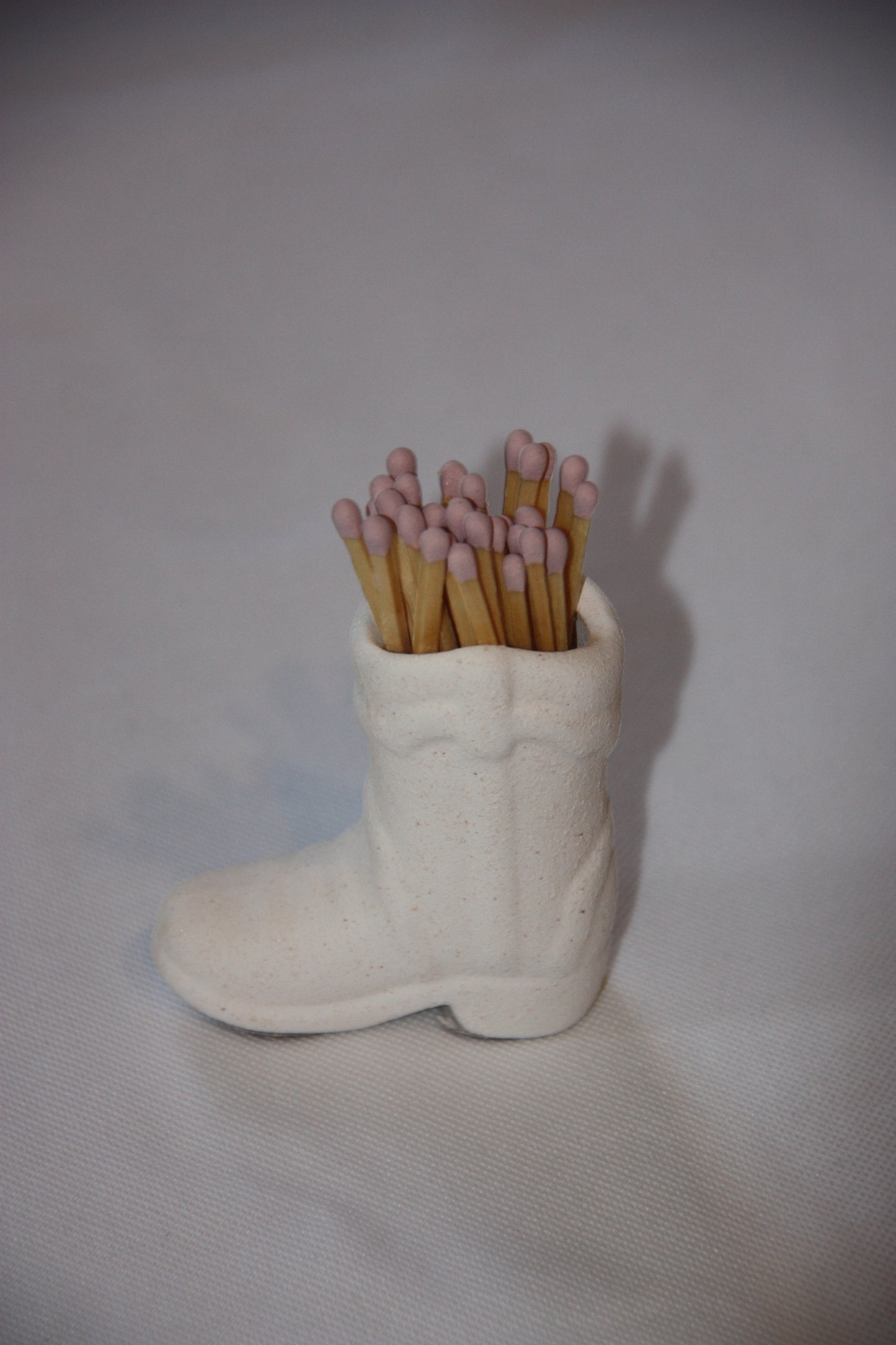 Cowboy match holder